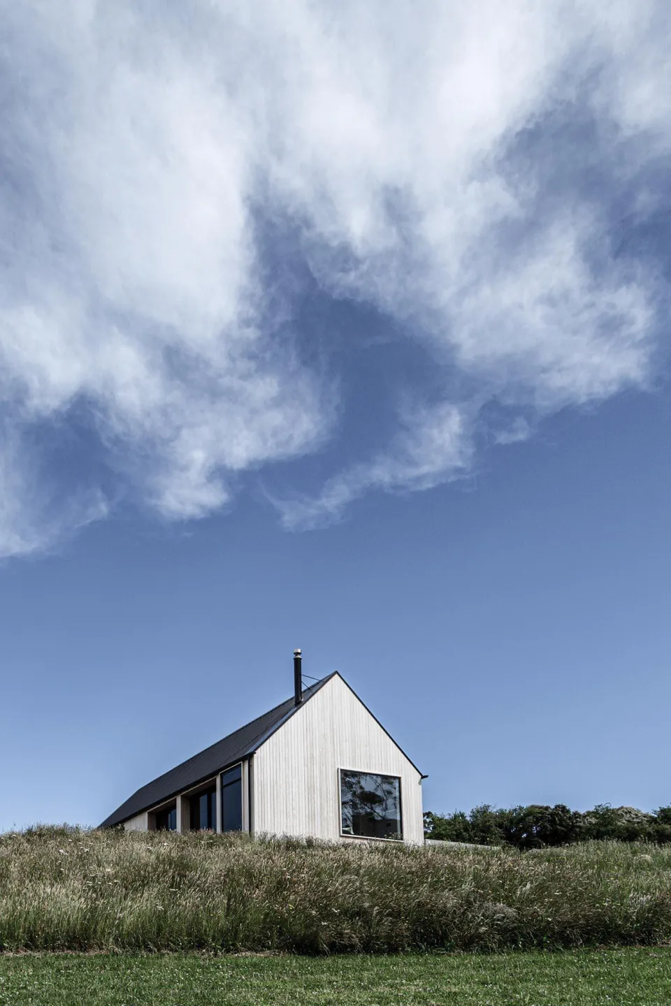 Coastal Banks Peninsula House Vulcan Cladding in Sioox finish Abodo Wood 4