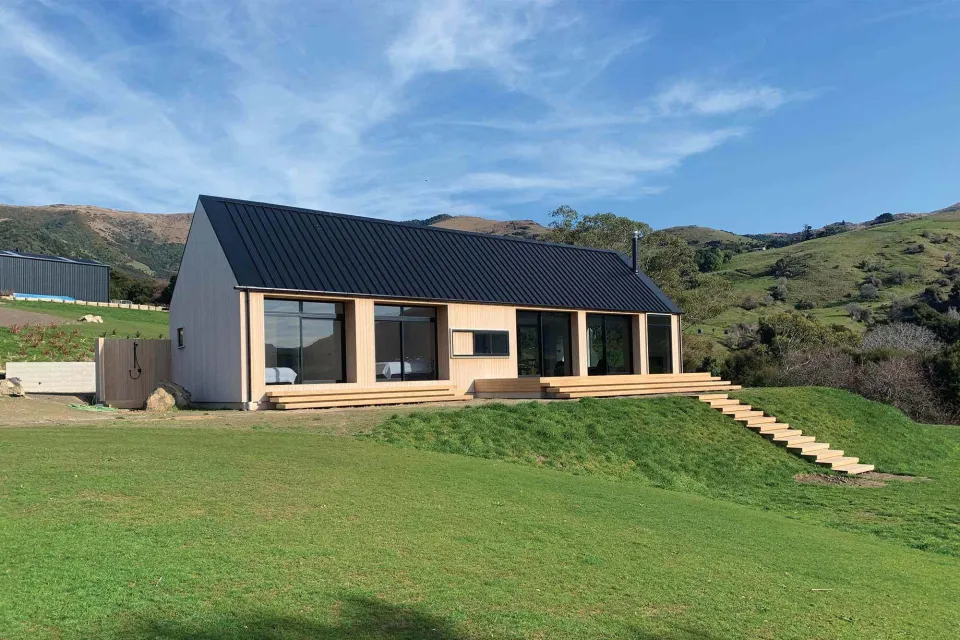 Coastal Banks Peninsula House Vulcan Cladding in Sioox finish Abodo Wood 2